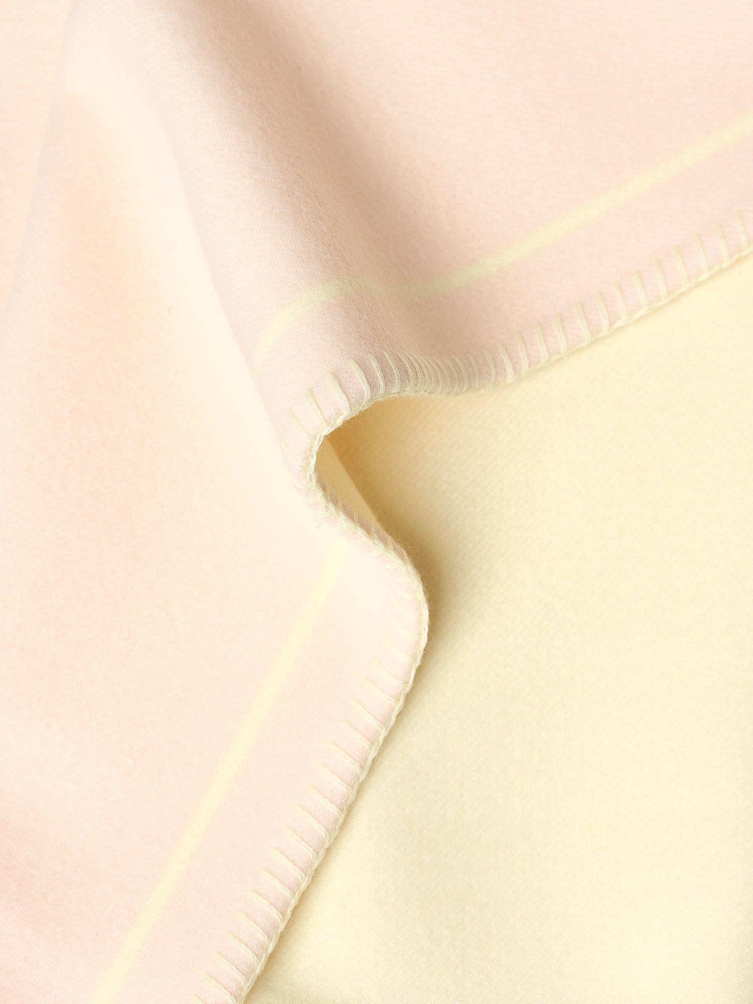 Kvadrat Raf Simons Kids Collection Wool Jacquard Blanket in Peach and Light Yellow. Detail image