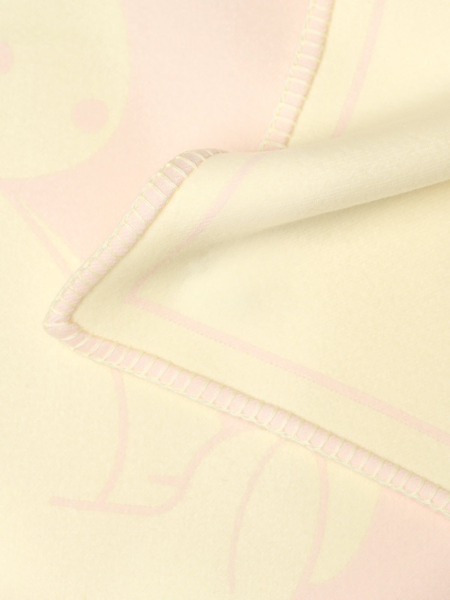 Kvadrat Raf Simons Kids Collection Wool Jacquard Blanket in Peach and Light Yellow. Detail image