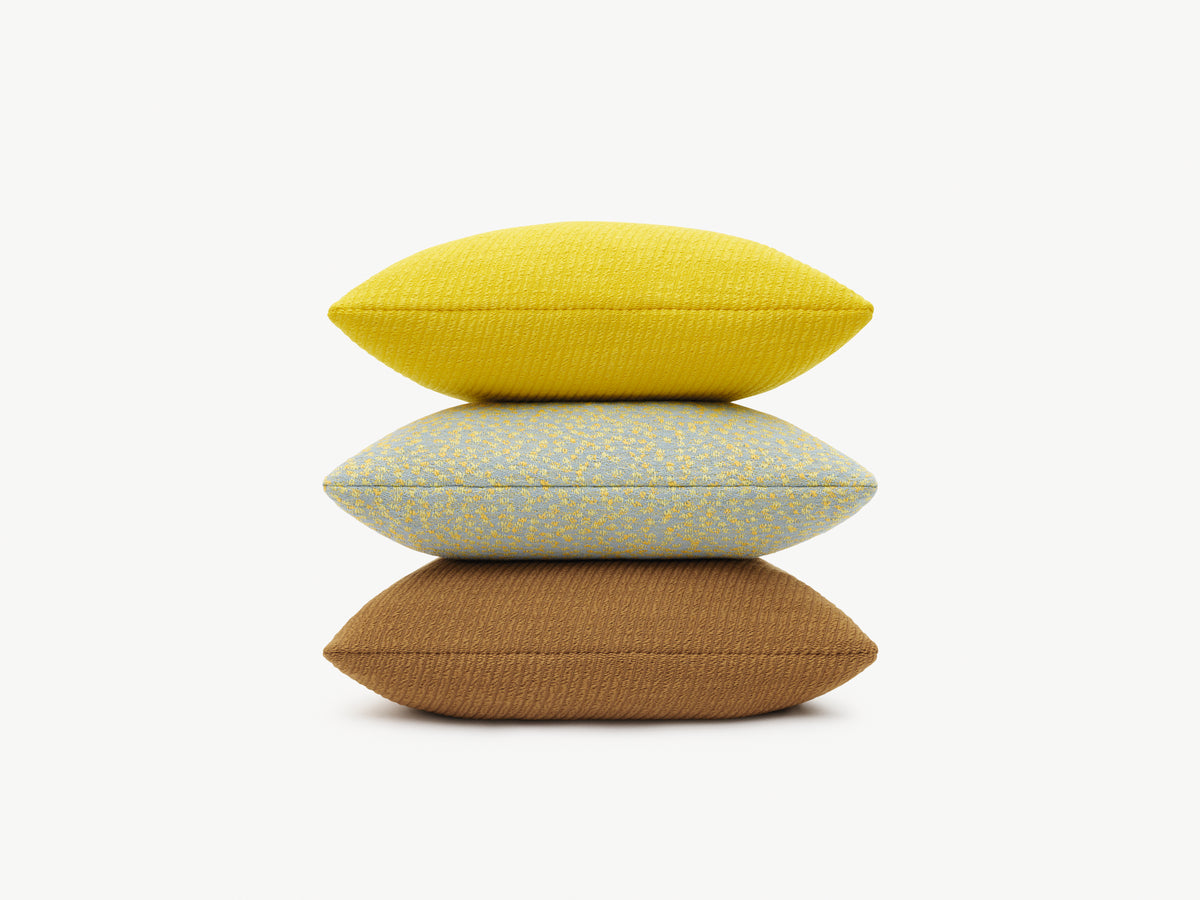Kvadrat Raf Simons cushion stack. Phlox Yellow, Ria Yellow and Phlox brown
