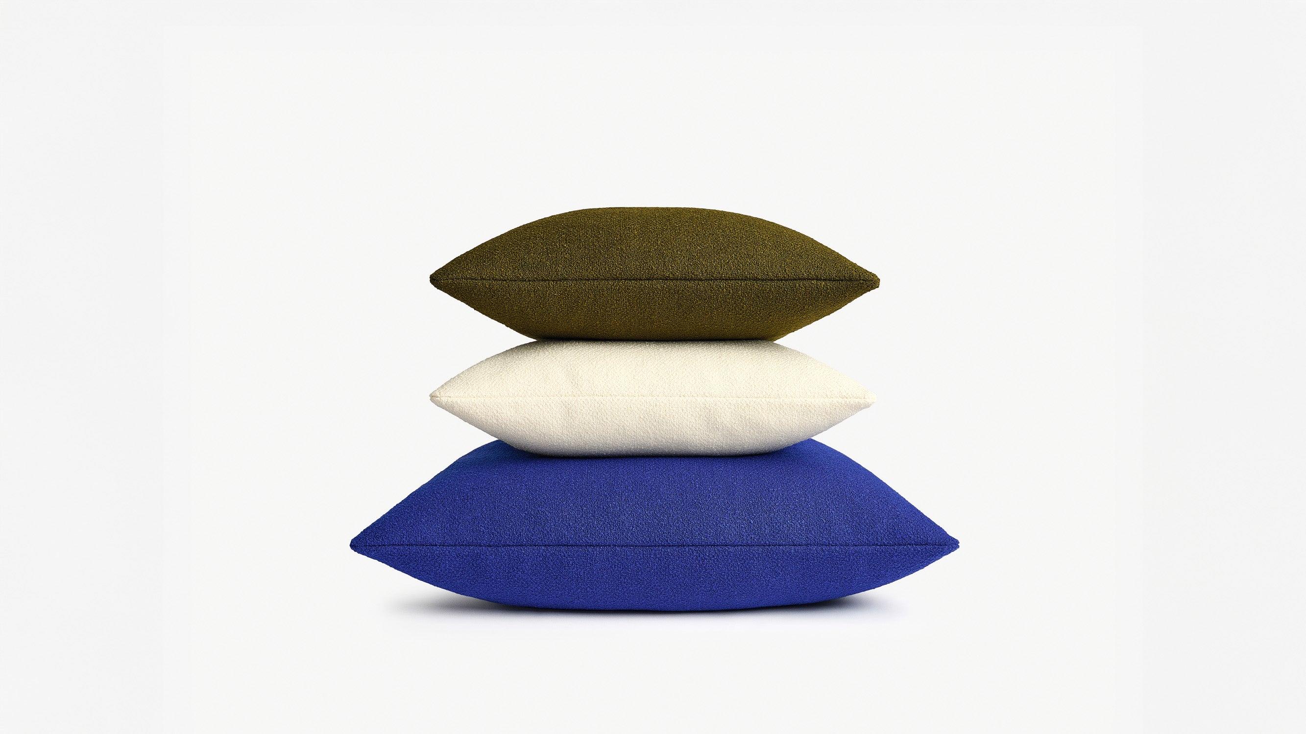 Kvadrat Raf Simons Cushion stack in Saxion Brown, Off White and Blue. 